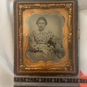 Daguerreotype photo of middle aged woman. Sitting pretty